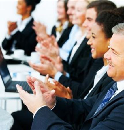 adults clapping at a Associations conference